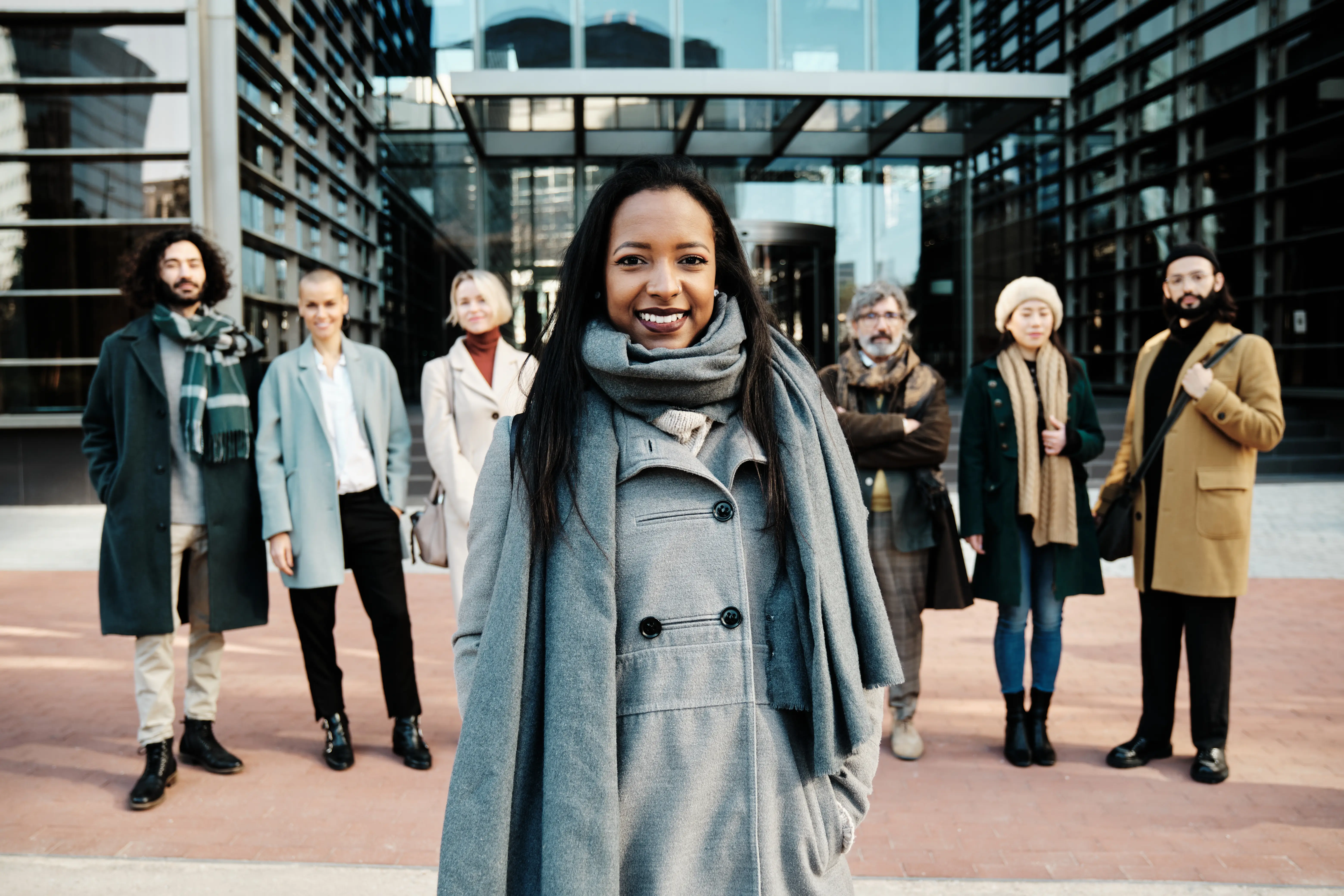 leading-businesswoman-standing-out-from-a-group-of-2025-03-09-18-51-41-utc